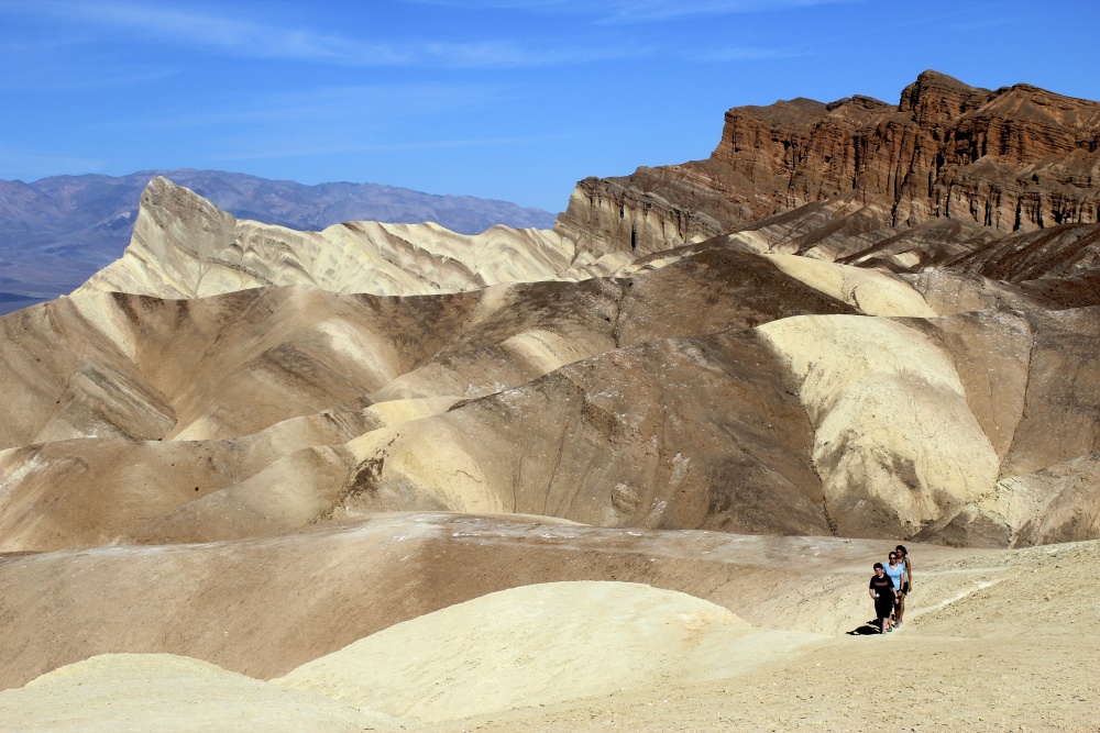 Hikers exploring dunes in Death Valley