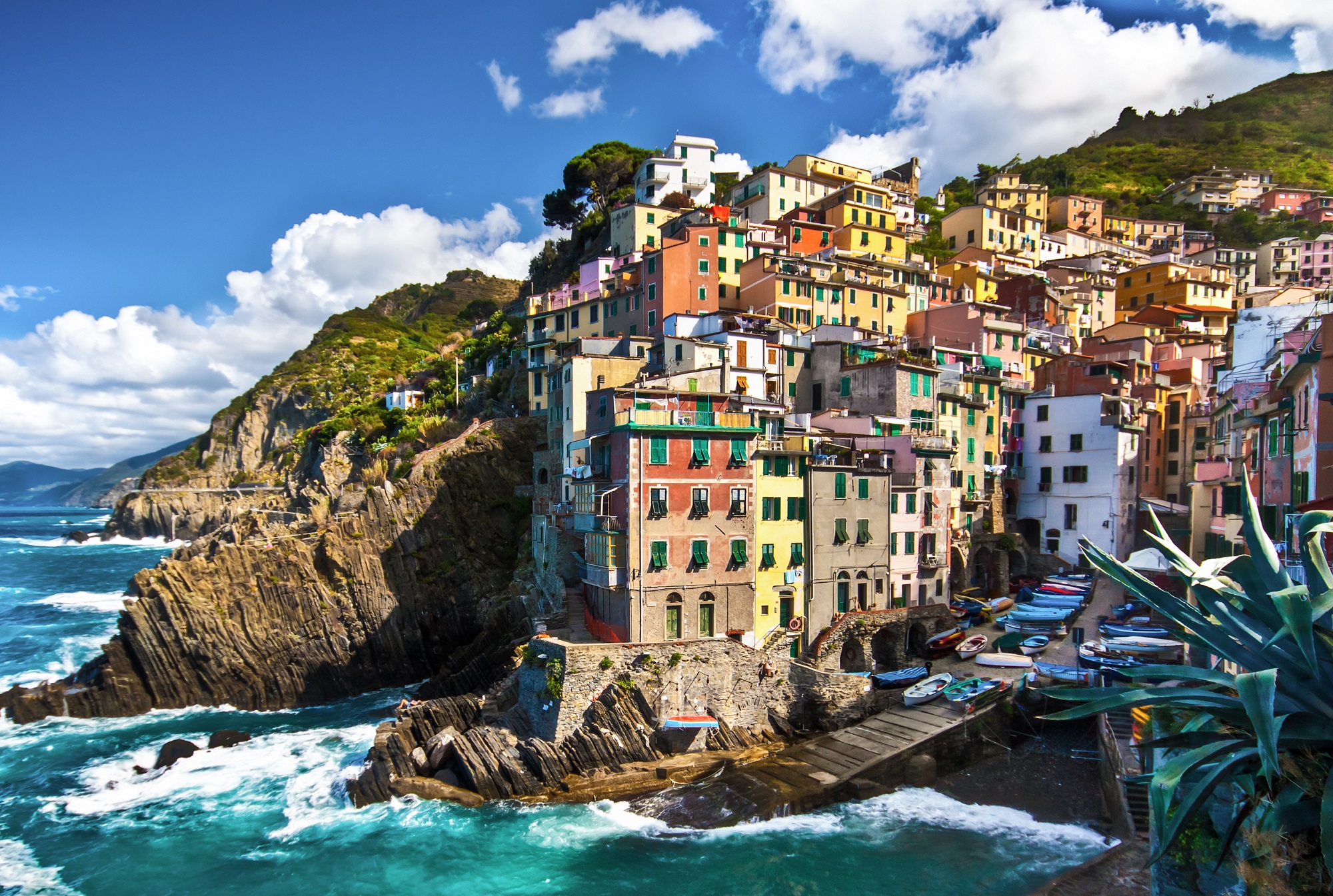 Cliffside by the ocean with buildings on top