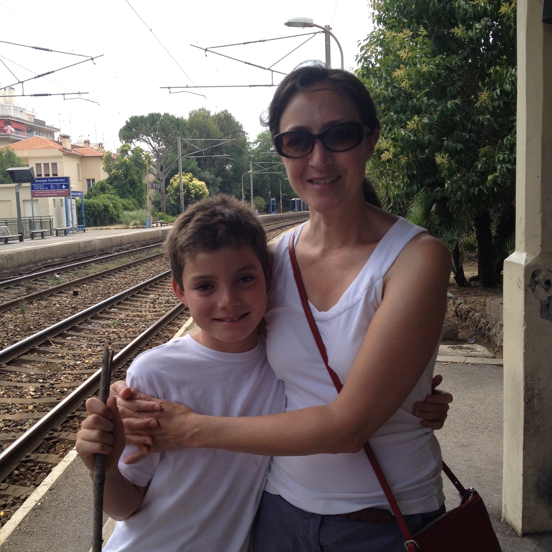 Woman hugging her son in her arms