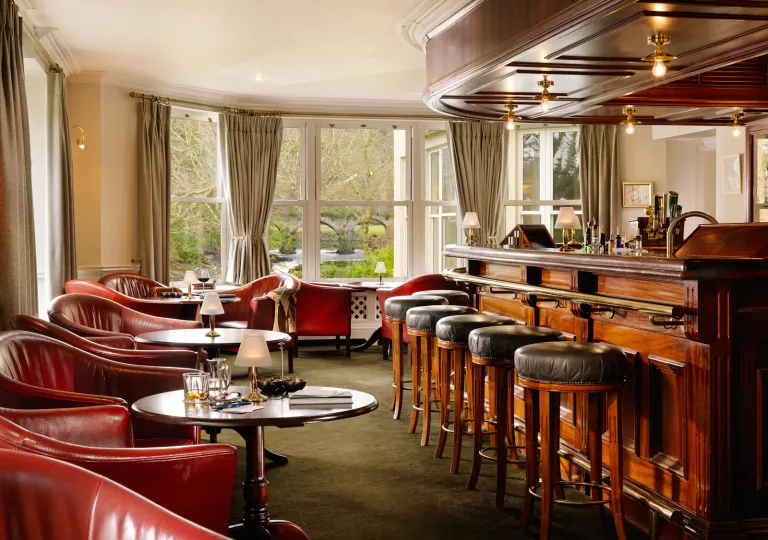 hotel bar with leather chairs and stools