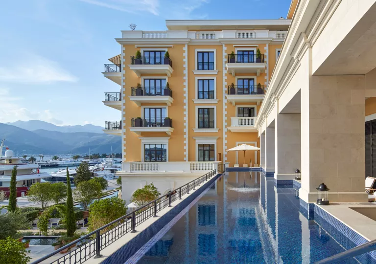 narrow swimming pool off of hotel