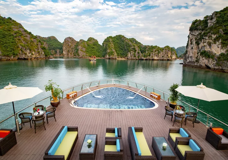 helm of boat with hot tub floating on river