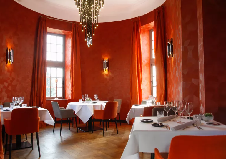 Red dining room with tables and chairs