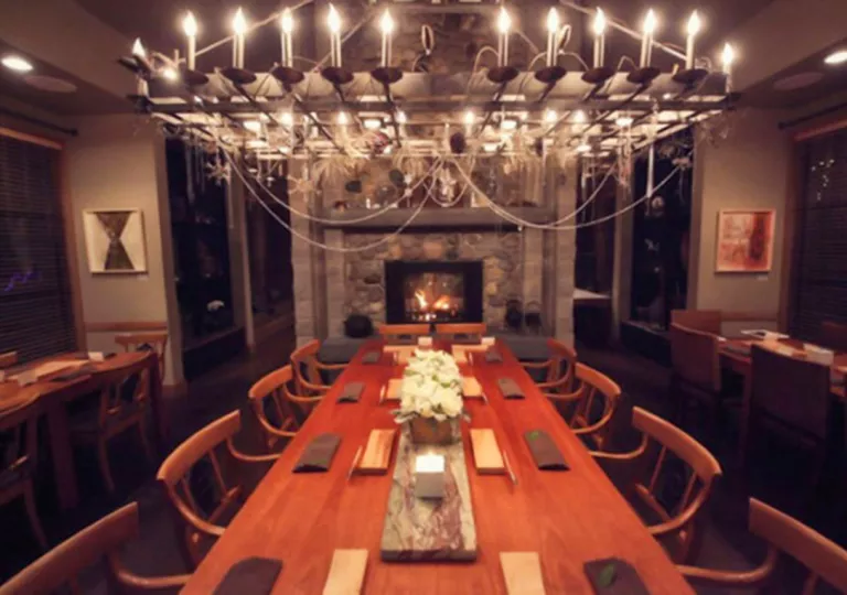 long dining room table under chandelier