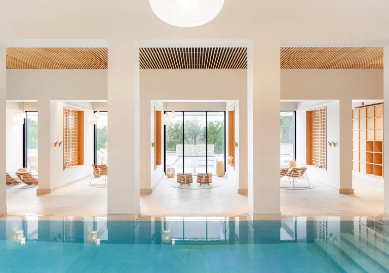 pool surrounded by tall columns