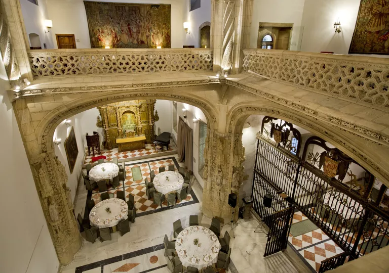 Two-story dining area with dining tables on the first floor
