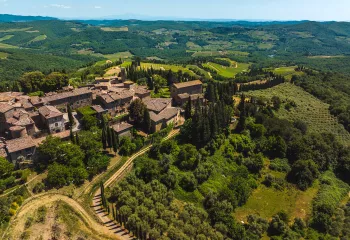 Bird's eye shot of Italian countryside villa and vineyard.