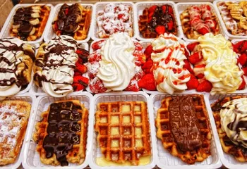 Variety of Belgian waffle desserts with toppings