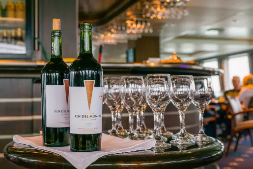 Shot of Fin Del Mundo wine bottles, glasses.