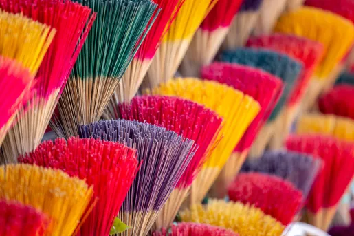 Vendor stall full of colorful incense sticks