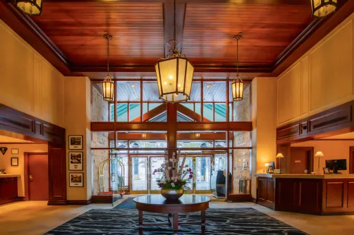 Hotel lobby with warm light fixtures hanging from the ceiling