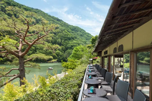 terrace with bistro tables looking out onto water