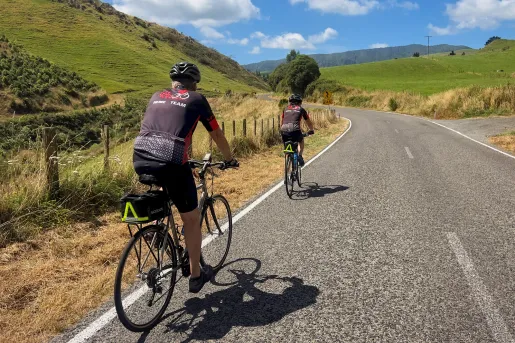backroads guests biking down a road