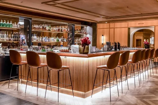 Bar with cushioned bar stools along the perimeter