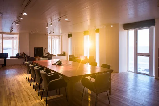 large dining room table in sunlit room