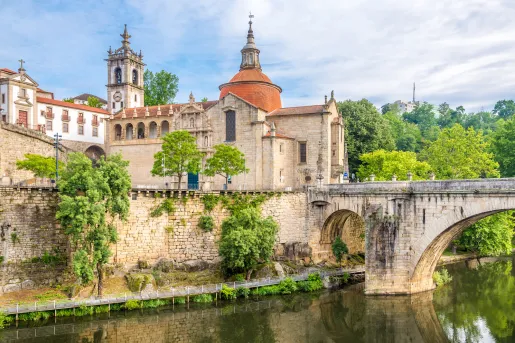 old stone buildings next to a river