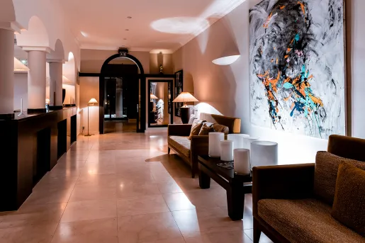 hotel lobby with desk and chairs