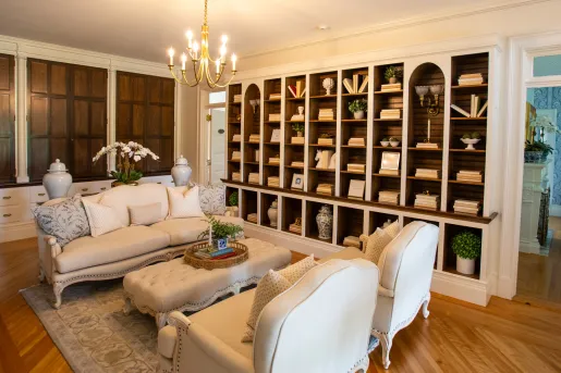 Library with cushioned sofas and books in the shelving