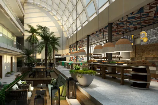 Modern hotel lobby with large windows and long dining tables
