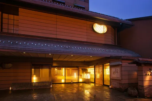 Exterior view of japanese hotel building in the evening