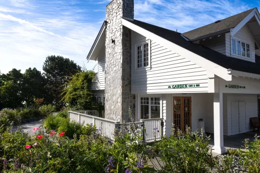 Sooke Harbour House hotel building exterior featuring a well-maintained garden lawn.
