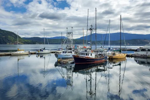 Boats in the calm harbor of Cowichan Bay on Vancouver Island, British Columbia.