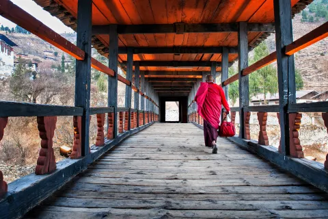 Monk walking along a corridor in Bhutan