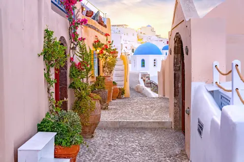Alleyway shot looking towards Med. coast, blue and white houses, etc.