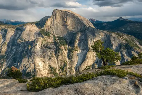 A view of Half Dome from the peak of a nearby mountain.