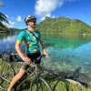 Riding a bike next to a bay in Tahiti