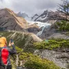 Guest taking photo of snowy mountain.