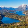Multiple lakes surrounded by tall trees and mountains