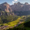 Large valley wit thick forest and tall mountains on either side