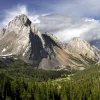 Large mountains with a valley of trees on the ground floor