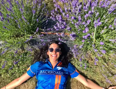 Guest laying among lavender bushes.