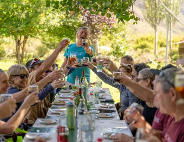 table of guests cheersing